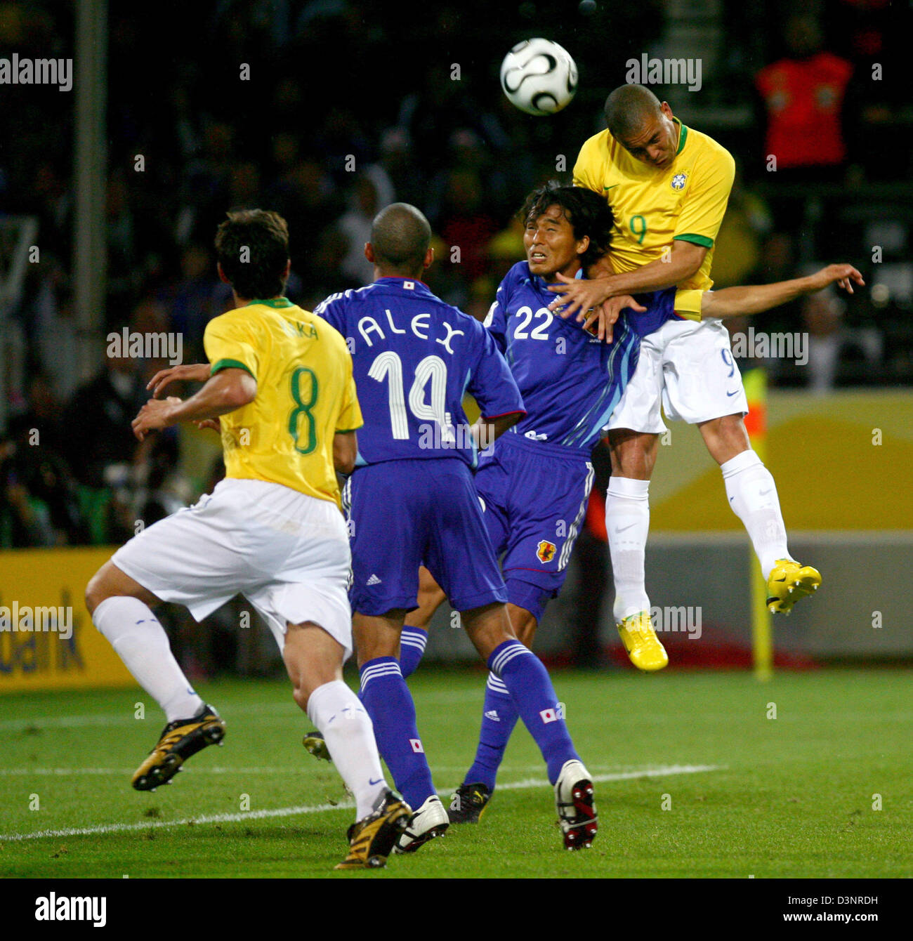 Ronaldo (R) from Brazil vies for the ball with his teammate Kaka (L) and Japanese Alessandro Santos (2.L) and Yuji Nakazawa (2.R) during the group F match of 2006 FIFA World Cup between Japan and Brazil in Dortmund, Germany, Thursday 22 June 2006.  DPA/FELIX HEYDER +++ Mobile Services OUT +++ Please refer to FIFA's Terms and Conditions. Stock Photo