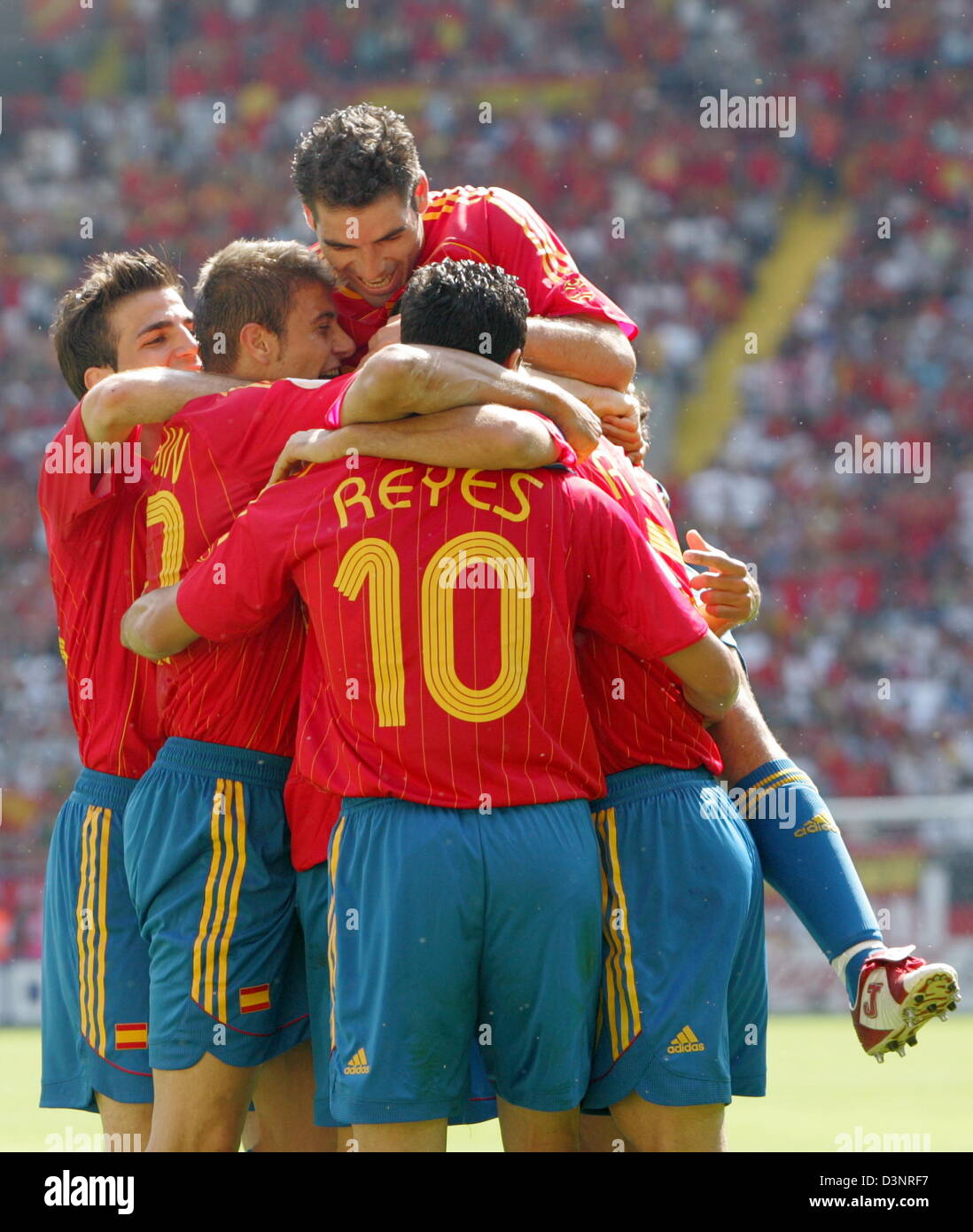 Spanish players celebrate with goalscorer Juanito (hidden) after