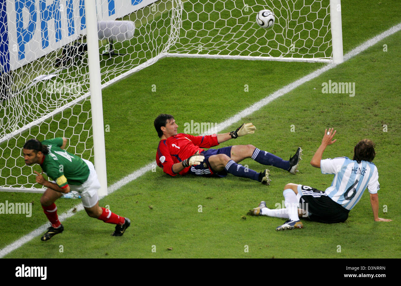 Rafael Marquez (L) of Mexico scores the 1-0 lead in the 2006 FIFA World Cup Round of 16 match Argentina vs Mexico at the FIFA World Cup stadium in Leipzig, Germany, Saturday 24 June 2006. Argentinian Gabriel Heinze (R) and goalie Roberto Abbondazieri (C) lie helpless on the grass. DPA/JAN WOITAS +++ Mobile Services OUT +++ Please refer to FIFA's Terms and Conditions. +++(c) dpa - B Stock Photo