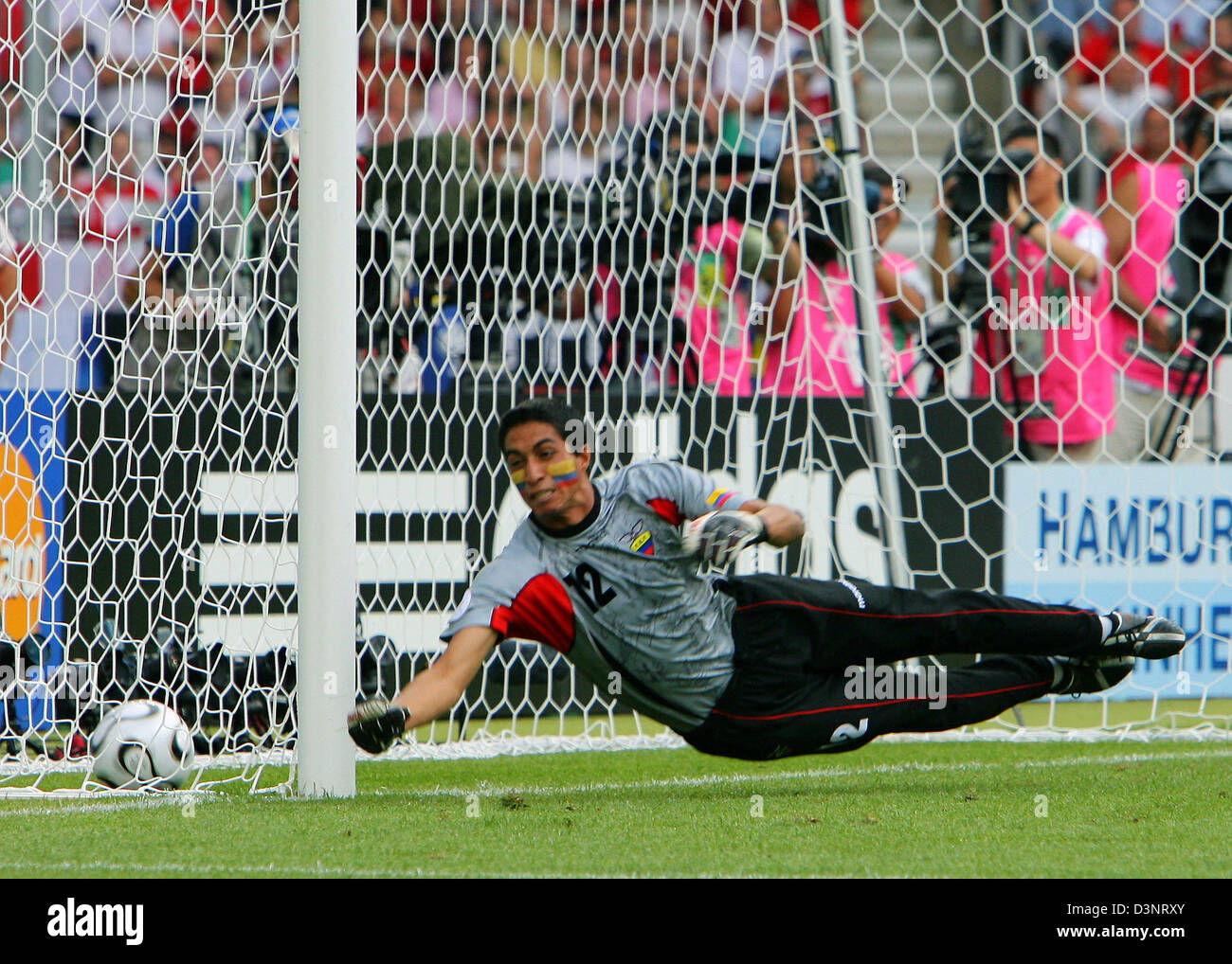 David Beckham (not pictured) of England scores the 1-0 lead against goalkeeper of Ecuador Cristian Mora during the 2nd round match of the 2006 FIFA World Cup between England and Ecuador in Stuttgart, Germany, Sunday, 25 June 2006. DPA/ARNE DEDERT +++ Mobile Services OUT +++ Please refer to FIFA's terms and conditions Stock Photo