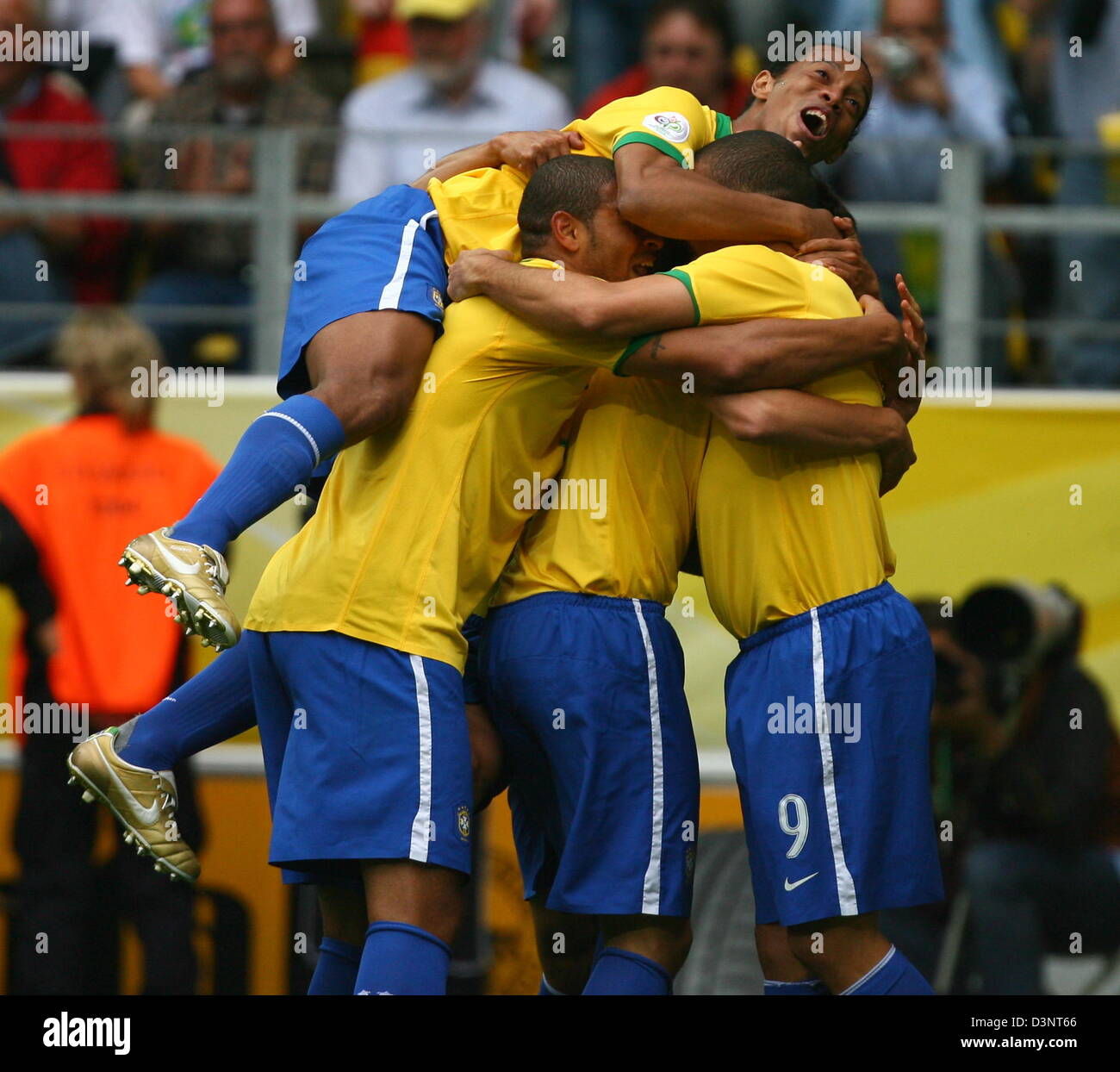 Ronaldo (R) from Brazil celebrates with his teammates Ronaldinho (Up) and Adriano (M) after scoring the 1-0 lead during the 2nd round match of the 2006 FIFA World Cup between Brazil and Ghana in Dortmund, Germany, Tuesday, 27 June 2006. Photo: FELIX HEYDER +++ Mobile Services OUT +++ Please refer to FIFA's terms and conditions Stock Photo