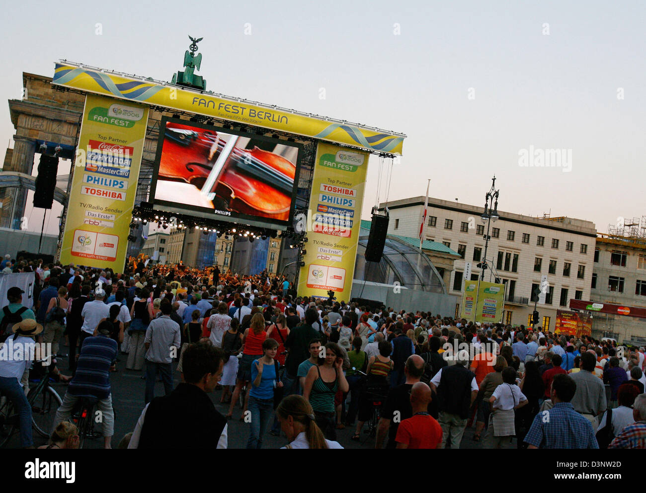 A violin played by a member of the Berlin Philharmonic Orchestra is projected onto a screen of the stage during the closing concert of the culture programme of the German government for the World Cup in Berlin, Sunday 02 July 2006. Despite an accident, caused by a man who raced into the waiting crowd, thousands of people flocked to the fans mile to hear the concert by the motto "Oc Stock Photo