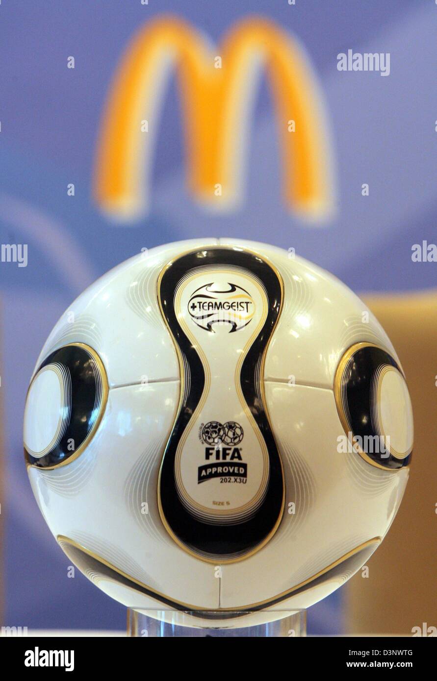 A World Cup ball lies in front of the logo of the fast food chain  McDonald's in Berlin, Germany, Saturday, 08 July 2006. Photo: Tim  Brakemeier Stock Photo - Alamy