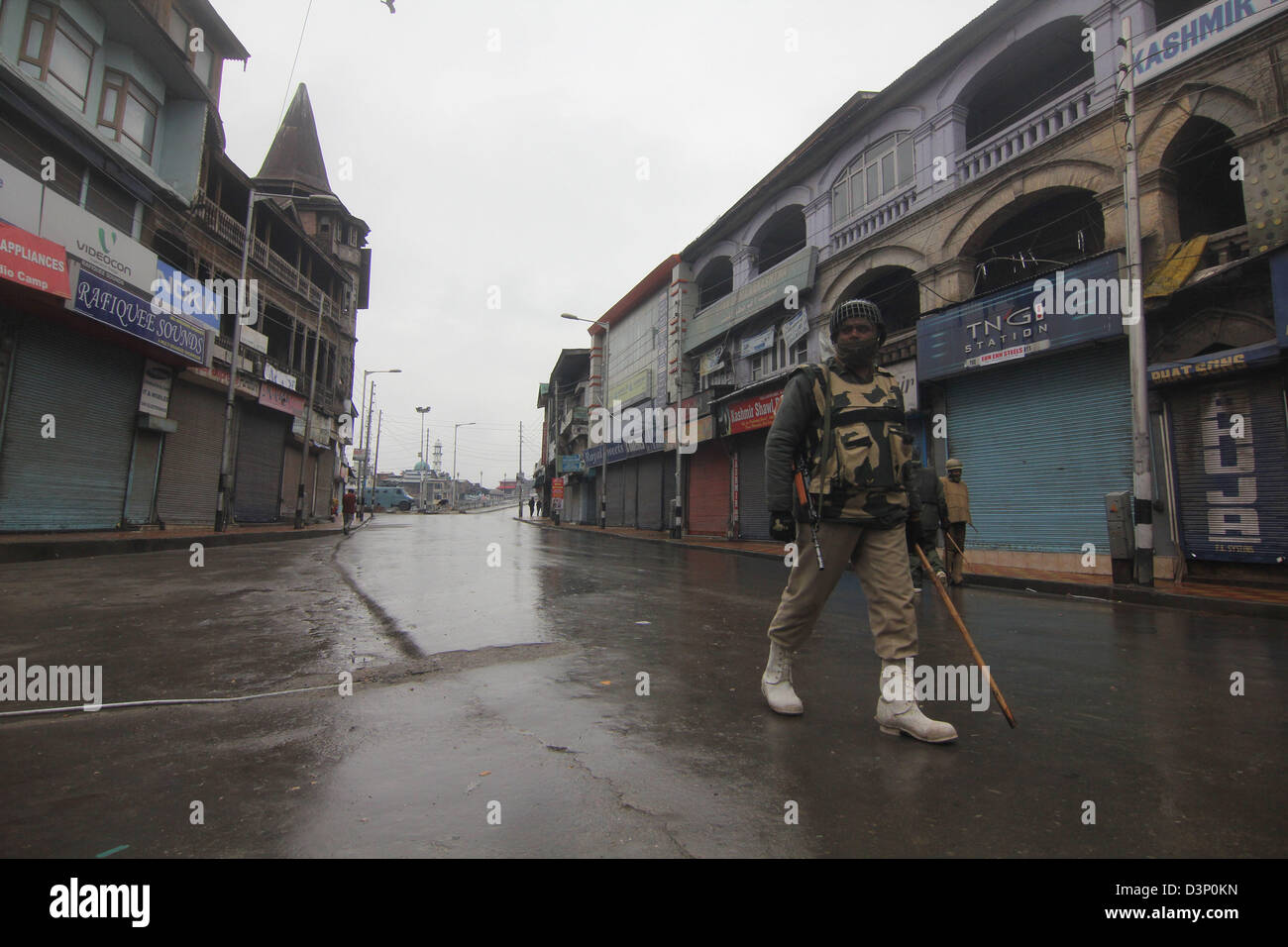 Feb. 22, 2013 - Srinagar, Kashmir, India - An Indian paramilitary soldiers  stands guard   during curfew in Srinagar, the summer capital of Indian Kashmir. on 22/2/2013,Authorities have imposed curfew or restrictions on movement of people in most parts of Kashmir Valley to foil plans of separatists to hold protests demanding handing over of the body of indian  Parliament attack convict Mohammad Afzal Guru to his family. Curfew has been imposed in 11 police station areas of Srinagar city and some other towns of the Valley as a precautionary measure, a police spokesman said on Friday. .Photo/Alt Stock Photo