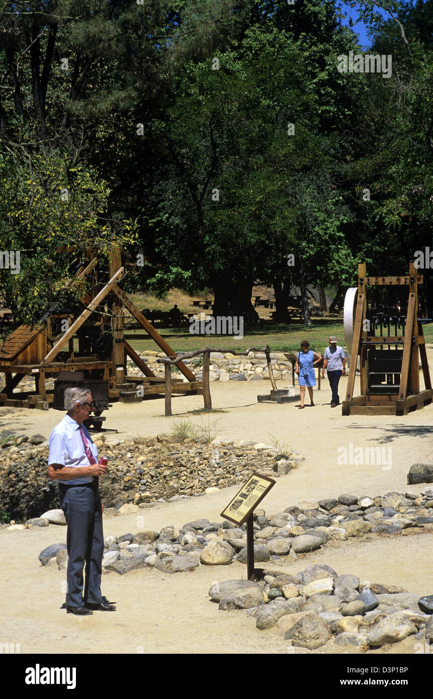 Visitors explore the mining exhibits at Marshall Gold Discovery State Historic Park, Coloma, California, USA. Stock Photo
