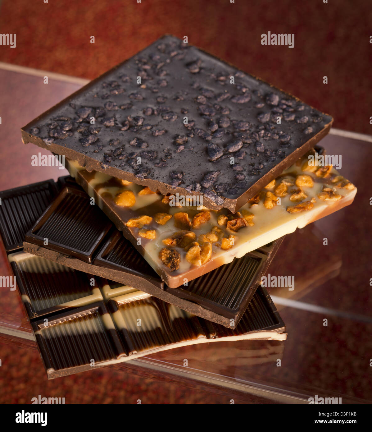 https://c8.alamy.com/comp/D3P1KB/different-types-of-chocolate-bars-stacked-on-top-of-each-other-D3P1KB.jpg