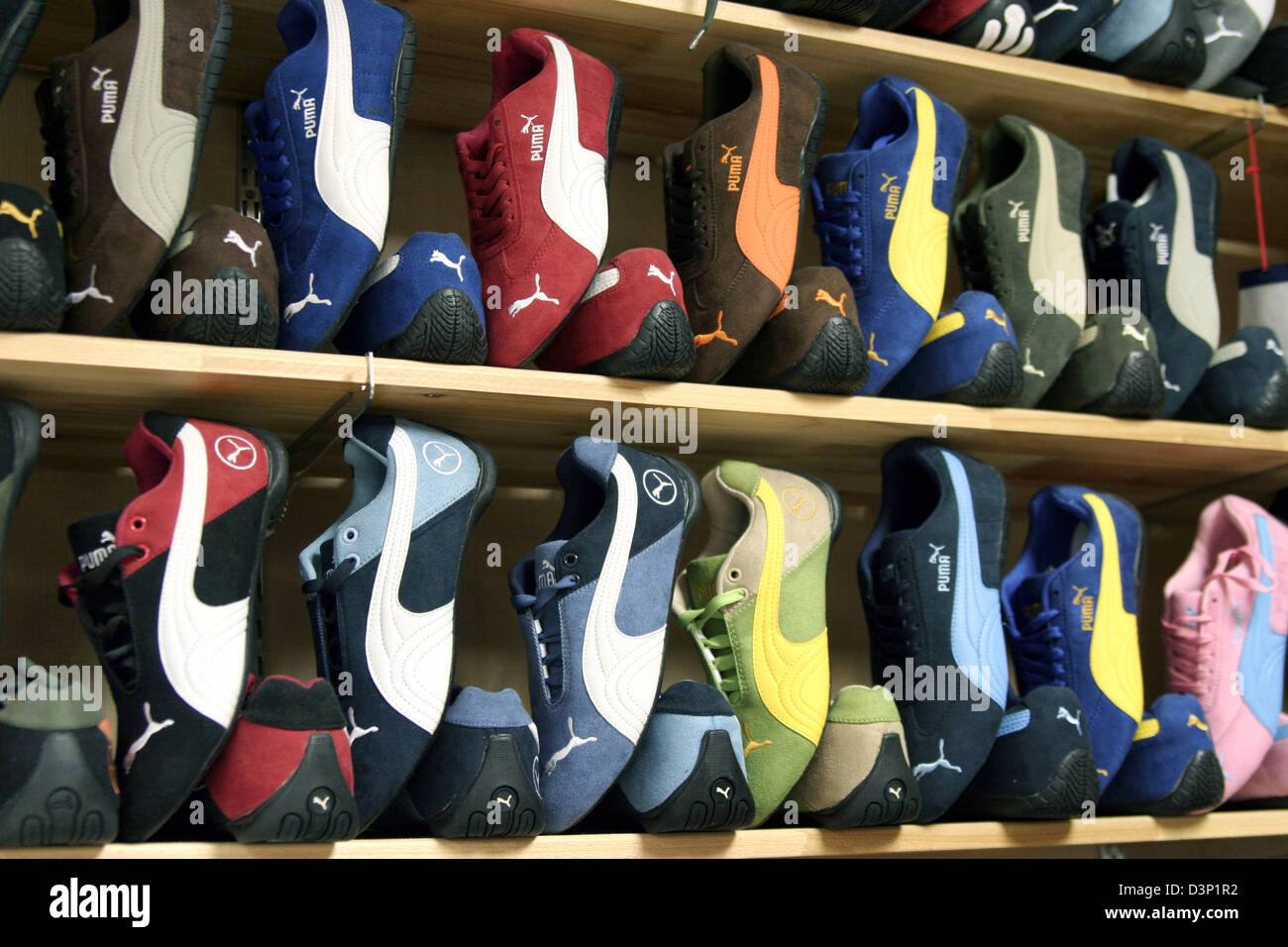 Puma sneakers in different colours are for sale in a store in Beijing,  China, 30 June 2006. But since the price is only 14 euros for each pair it  seems that the