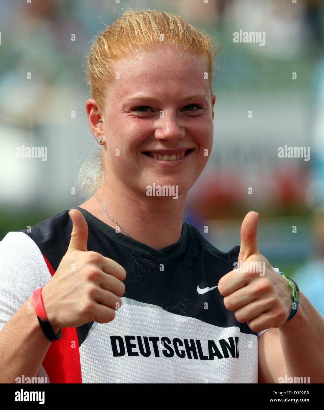 German Betty Heidler signals thumbs up after the hammer throwing