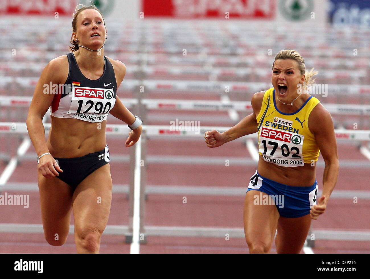 Swedish athlete Susanna Kallur (R) cheers winning the 110m Hurdles