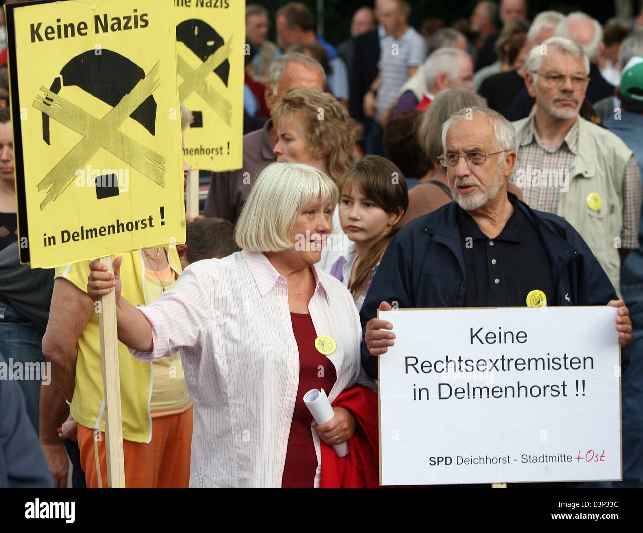 Demonstrators hold signs that read 'No Nazis in Delmenhorst' during a rally in front of the 'Hotel Am Stadtpark' in Delmenhorst, Germany, Wednesday, 16 August 2006. The hotel owner considers to bestow the property to a rightist extremist foundation. He made an effort to informed Radio Bremen on Tuesday, that a resale to the city financed through citizens' donations and the help of  Stock Photo