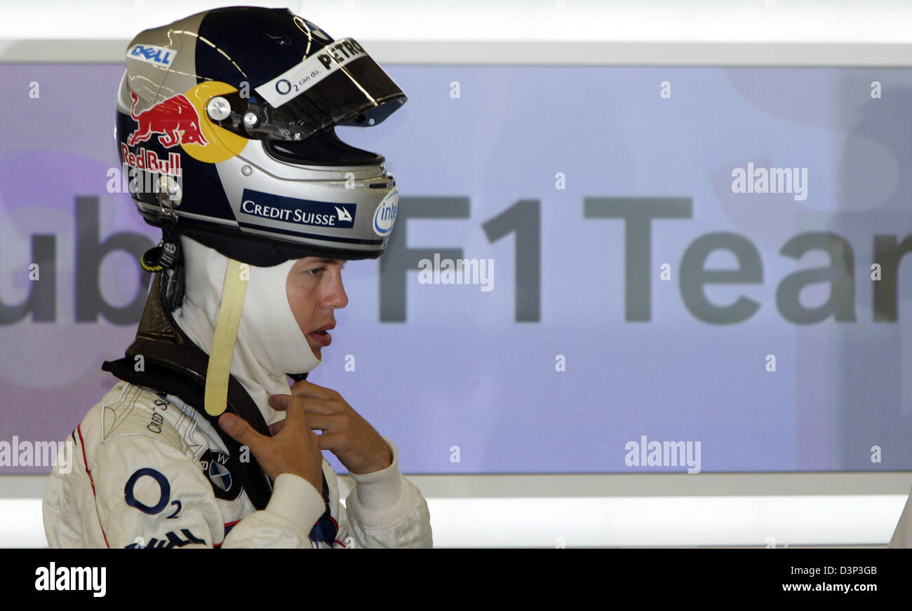 German Formula One test pilot Sebatian Vettel of BMW Sauber wears his helmet in the team garage at Istanbul Park circuit near Istanbul, Turkey, Thursday, 24 August 2006. Photo: Rainer Jensen Stock Photo