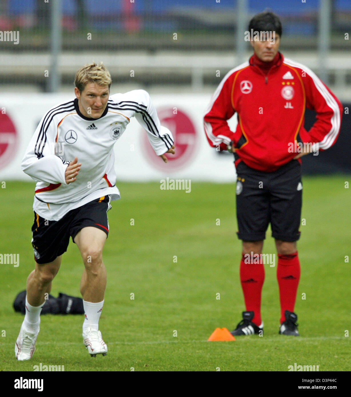 German National Soccer Team Head Coach Joachim Low And Player Bastian Schweinsteiger R Are Pictured During A Training Session At The Robert Schlienz Stadium In Stuttgart Germany Wednesday 30 August 2006 The German