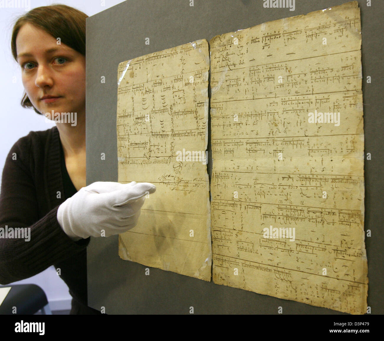 Paper restorer Nanett Woithe presents a hand written text by Johann  Sebastian Bach dated around 1700 in Weimar, Germany, Thursday, 31 August  2006. It is one of the earliest writings of Bach