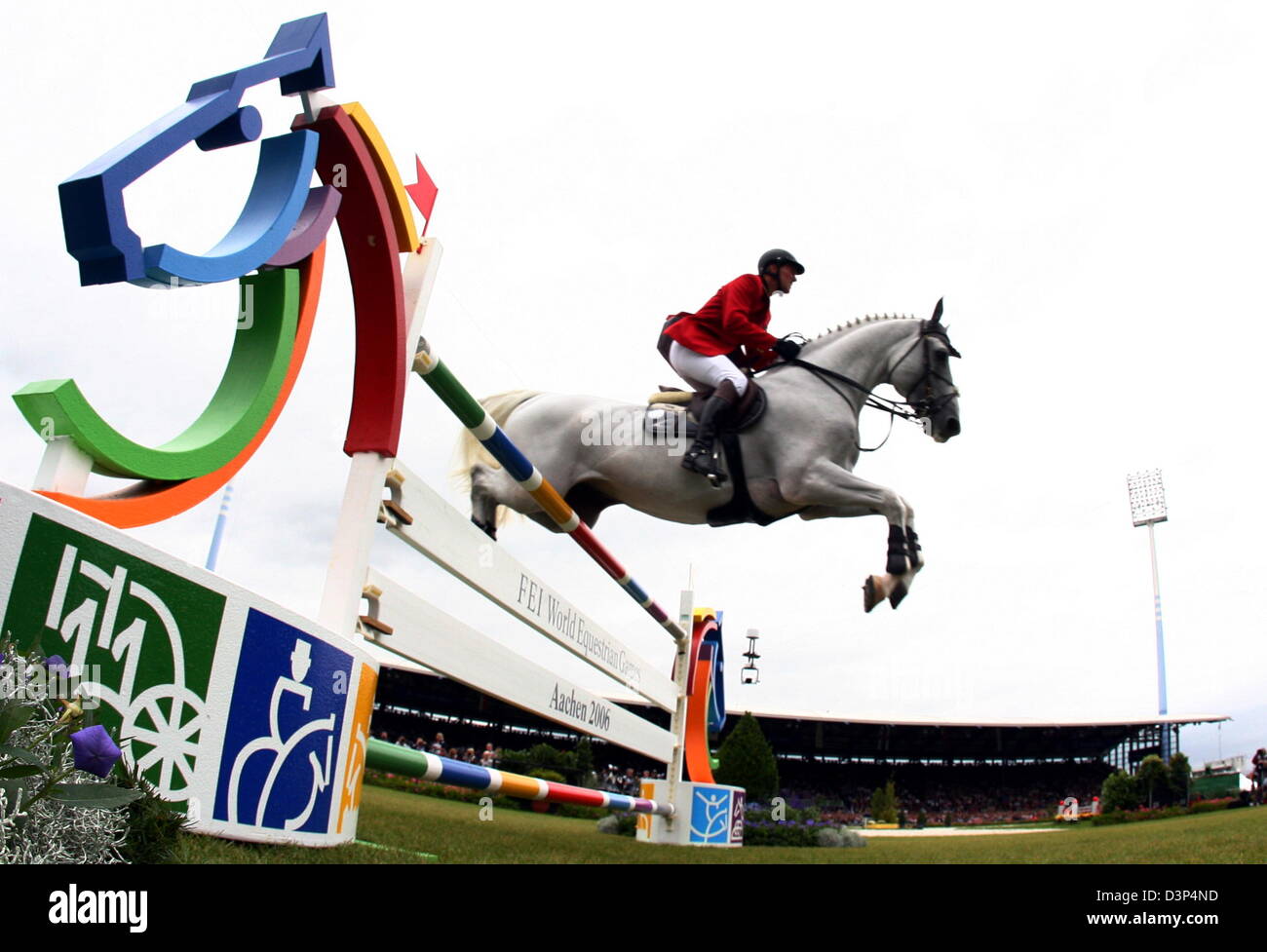 Belgian show jumper Jos Lansink and his horse 'Cavalor Cumano' take an