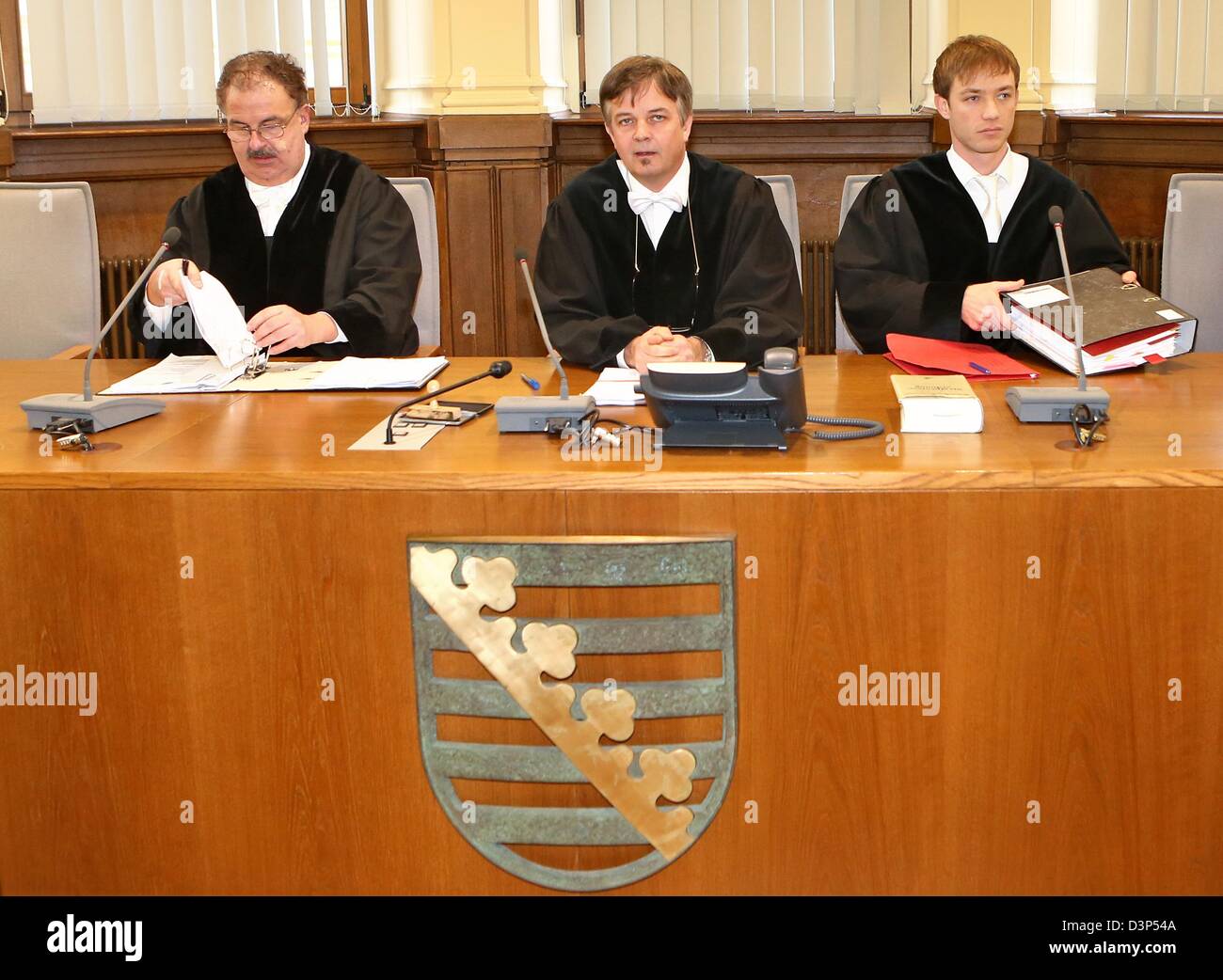 Presiding judge Berthold Pfuhl (M) and his associate judges open the trial at the Regional Court in Leipzig, Germany, 22 February 2013. Three men are suspected of drug smuggling and being member of a right-wing drug gang. The group allegedly dealt with Crystal from the Czech Republic. Photo: JAN WOITAS Stock Photo