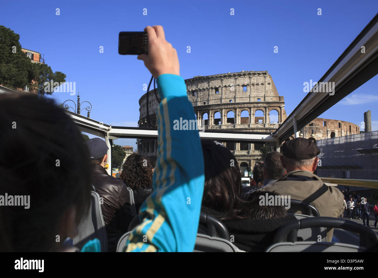 Open Top Bus Rome Tourists on an open top bus tour of Rome taking photographs of the ...