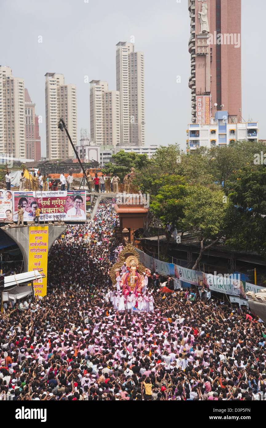 Crowd at religious procession during Ganpati visarjan ceremony, Mumbai, Maharashtra, India Stock Photo