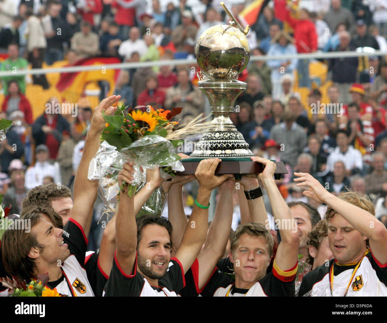 The German national field hockey team celebrate their title after their