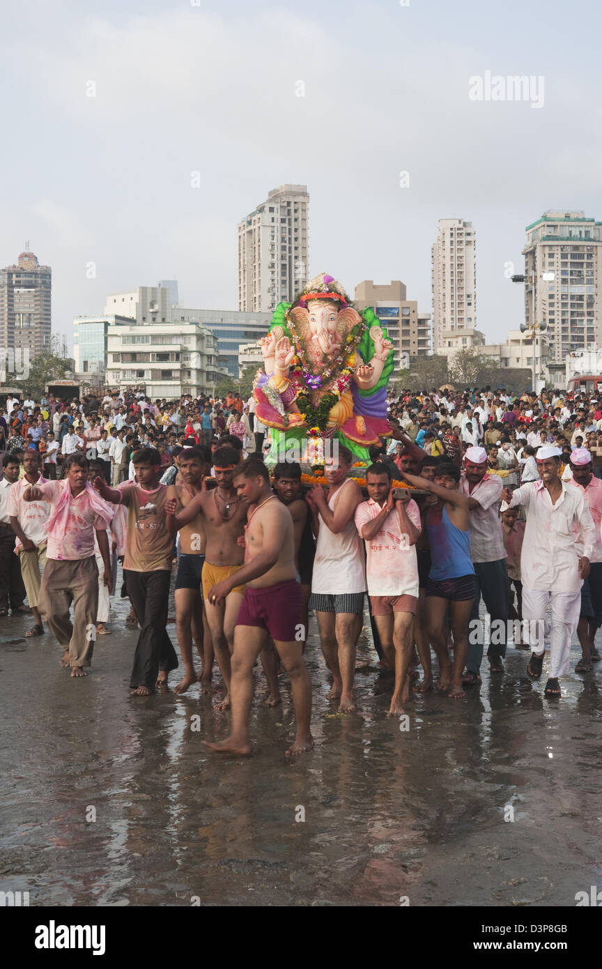 People at immersion ceremony of Lord Ganesha, Mumbai, Maharashtra, India Stock Photo