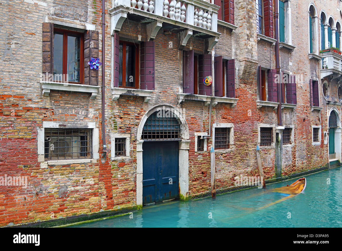 Doorway of a building on a canal in Venice, Italy Stock Photo