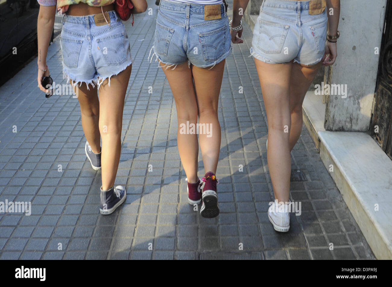 girls wearing short jeans