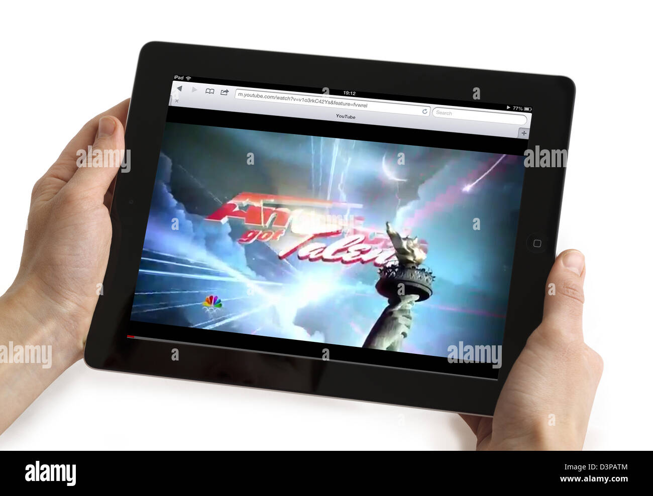 Watching a streaming video of America's Got Talent on YouTube on an iPad Stock Photo