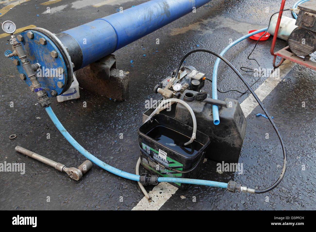 Pressure testing a pipe being installed during repairs to a water main, Scotland, UK, Europe Stock Photo