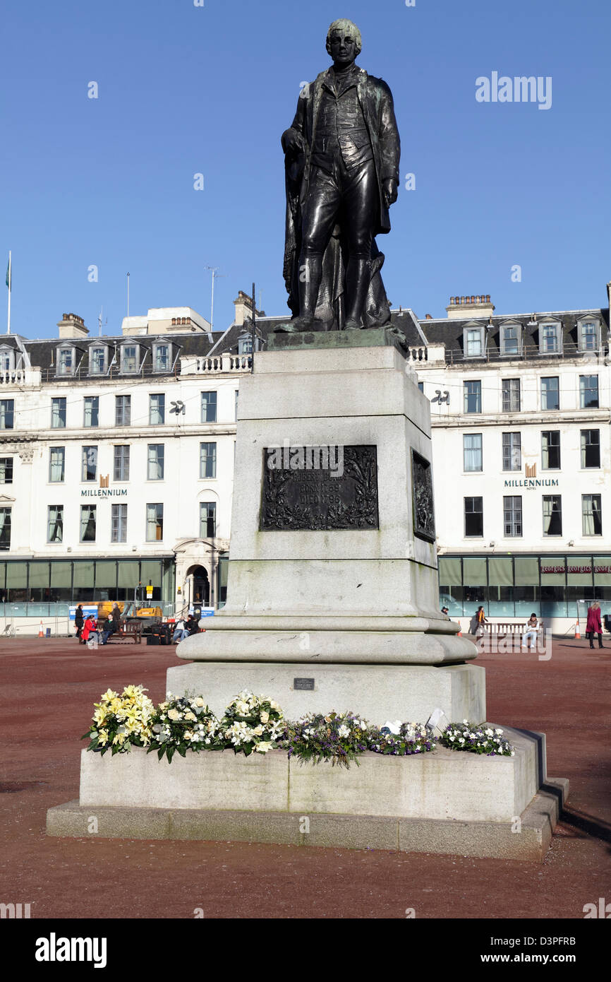 A statue of poet Robert Burns in George Square, Glasgow, Scotland, UK Stock Photo