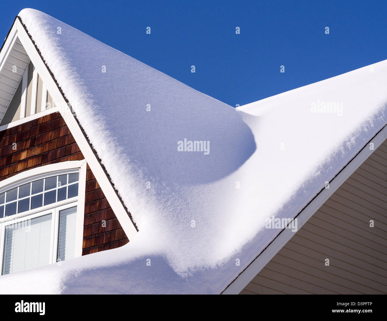 Snowy Roof. A thick blanket of snow covering the steep roof of an Ottawa house. Ottawa, Ontario