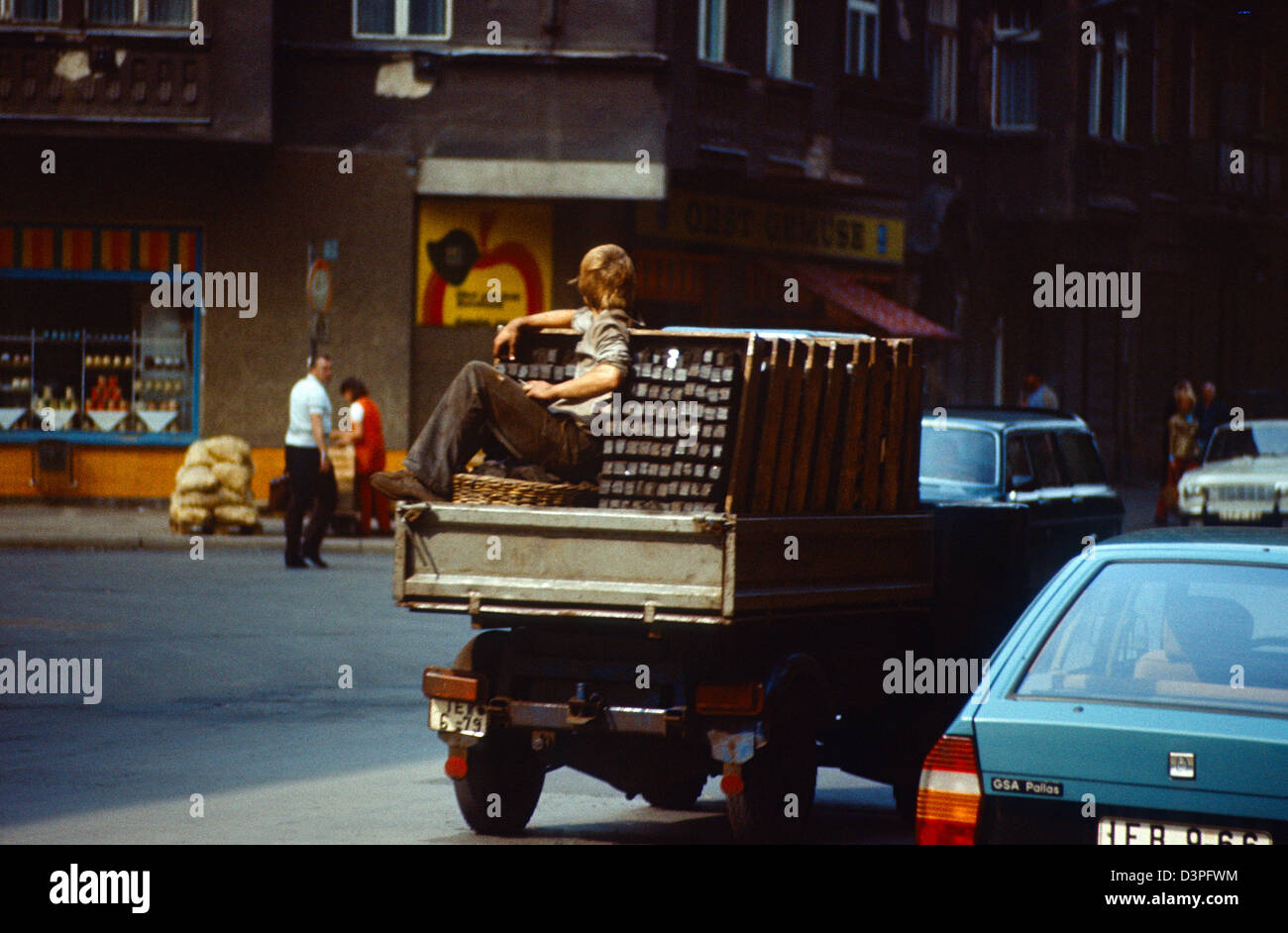 Berlin, GDR, sitting on the loading area of a pickup truck Stock Photo
