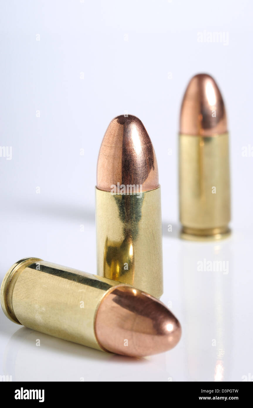 9mm Winchester Luger bullets against white backdrop. Stock Photo