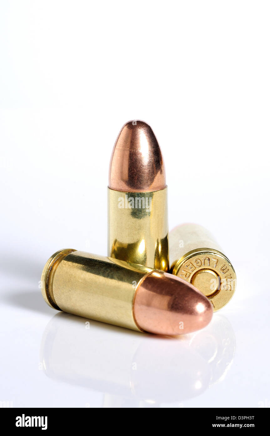 9mm Winchester Luger bullets against white backdrop. Stock Photo