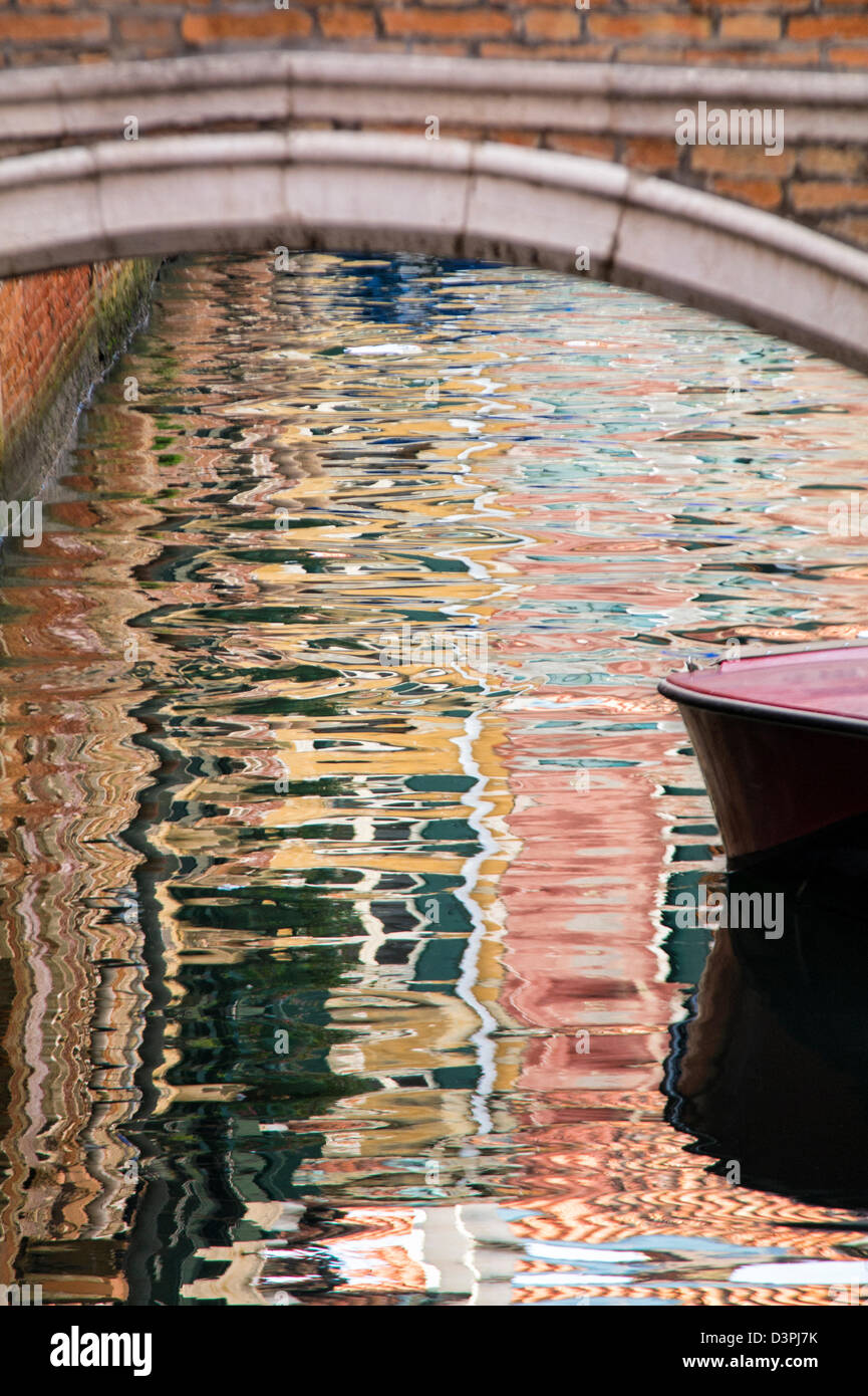 Reflections under a Bridge over a Canal in Venice Stock Photo