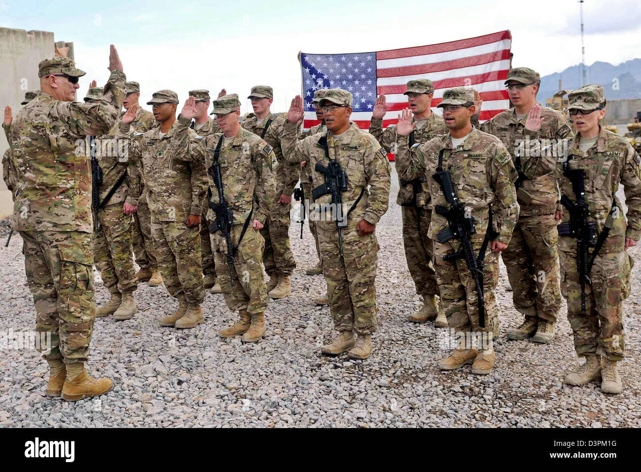 US Gen. Raymond Odierno, the Chief of Staff of the Army, reenlists soldiers from Forward Operating Base Frontenac  February 22, 2013 at Kandahar Airfield, Afghanistan. Stock Photo