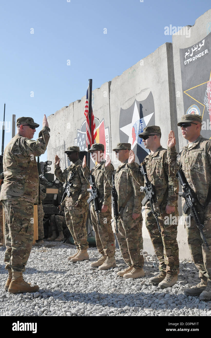 US Gen. Raymond Odierno, the Chief of Staff of the Army, leads a re-enlistment ceremony for soldiers of 4th Stryker Brigade Combat Team, 2nd Infantry Division February 22, 2013 at Forward Operating Base Masum Ghar, Afghanistan. Stock Photo