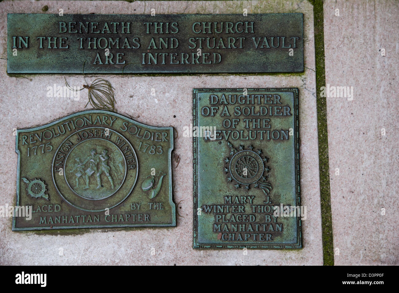 Bronze memorial plaques to soldiers of the American Revolution,Trinity Church Cemetery on Wall Street and Broadway Stock Photo