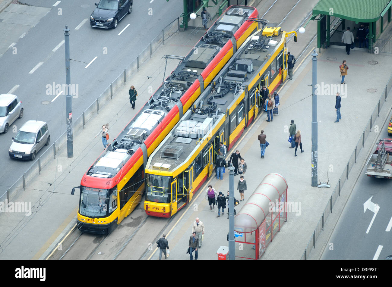 Yellow tram at Aleje Jerozolimskie (literally Jerusalem Avenues) - one of the main and longest street in Warsaw, Poland Stock Photo