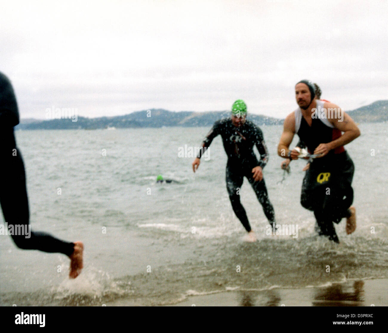 Swimmers racing on the shore Stock Photo - Alamy
