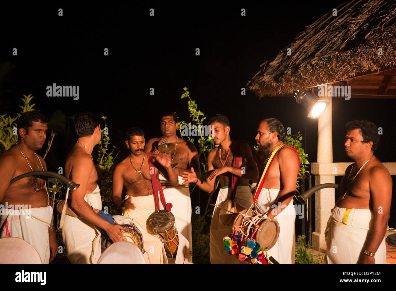 Group of people playing musical instrument during traditional festival