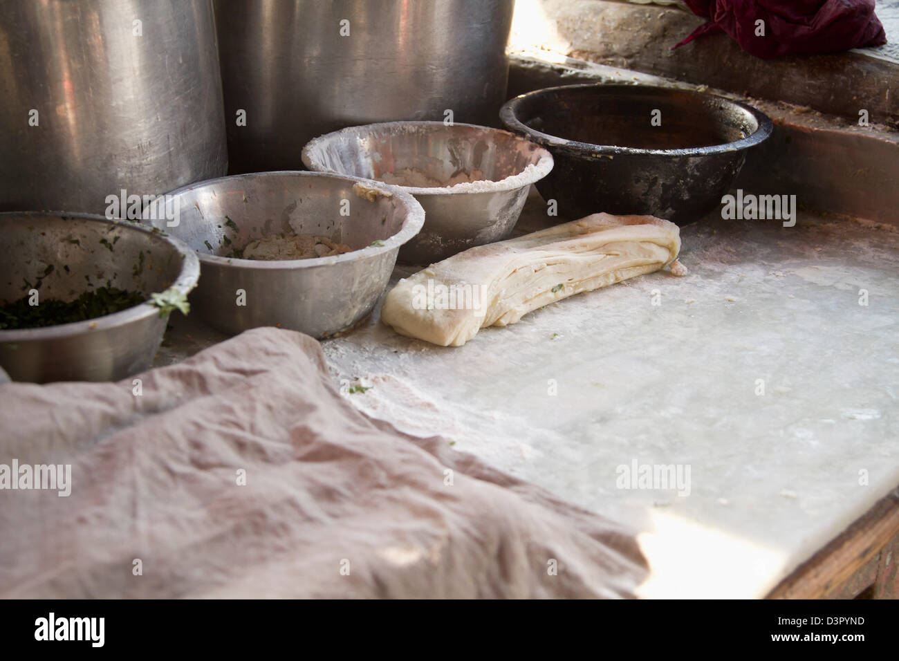 Close-up of dough with bowls, Amritsar, Punjab, India Stock Photo