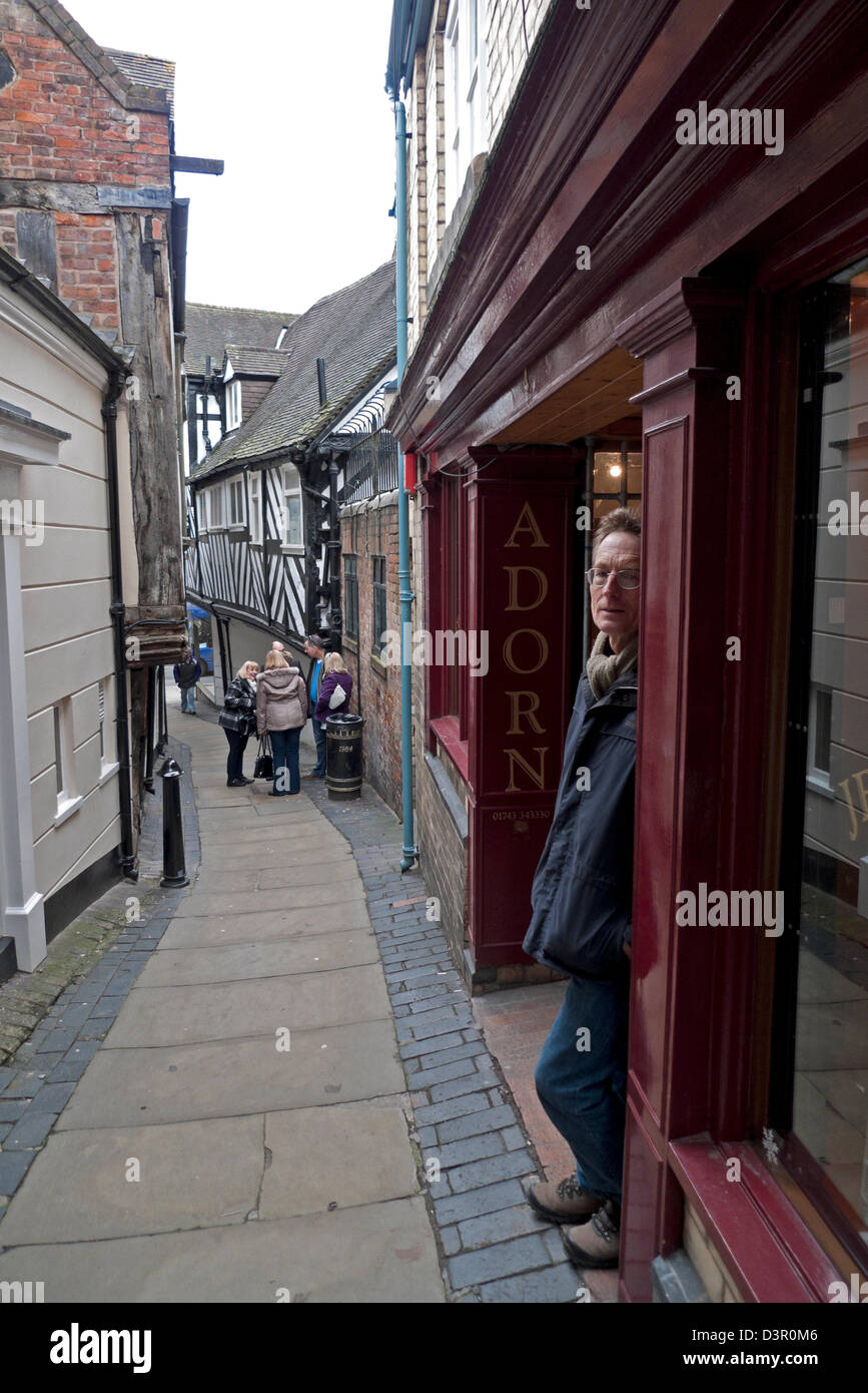 Man standing in a doorway in Grope Lane Shrewsbury Shropshire England UK Stock Photo