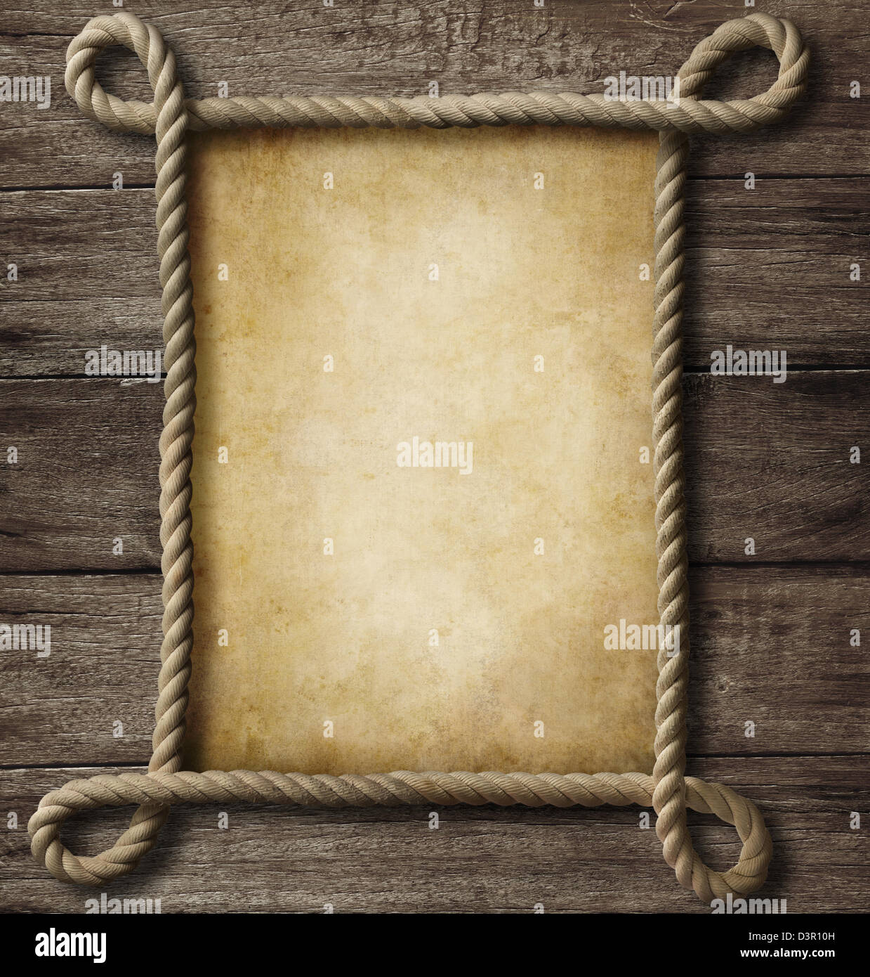 aged paper with rope frame on old wood background Stock Photo