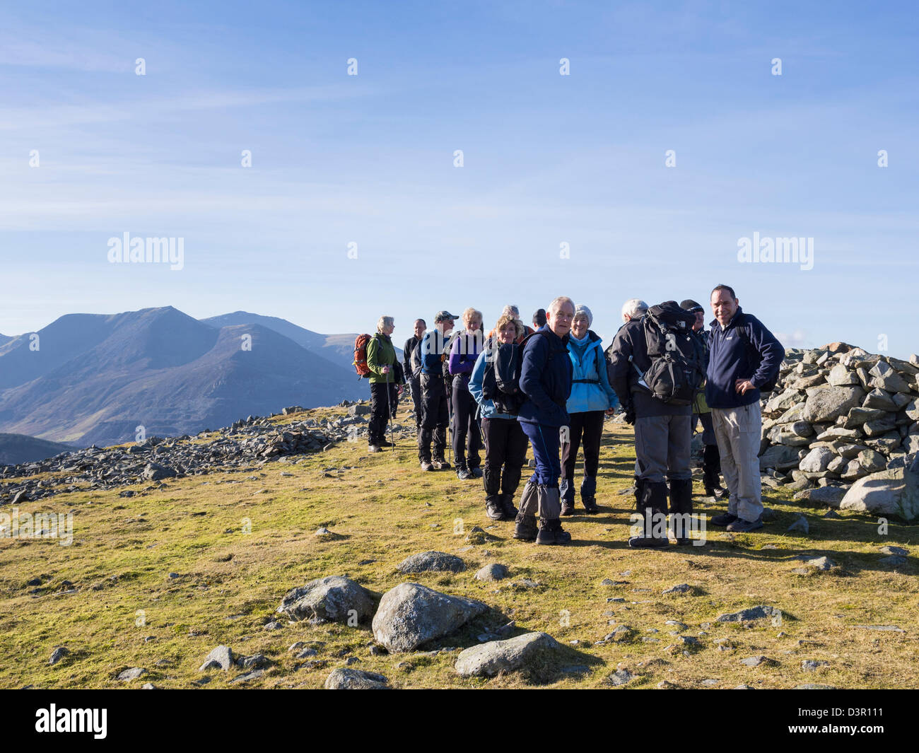 Ramblers group hiking on top of Moel Faban mountain in mountains of northern Snowdonia National Park. Bethesda, Gwynedd, North Wales, UK, Britain Stock Photo