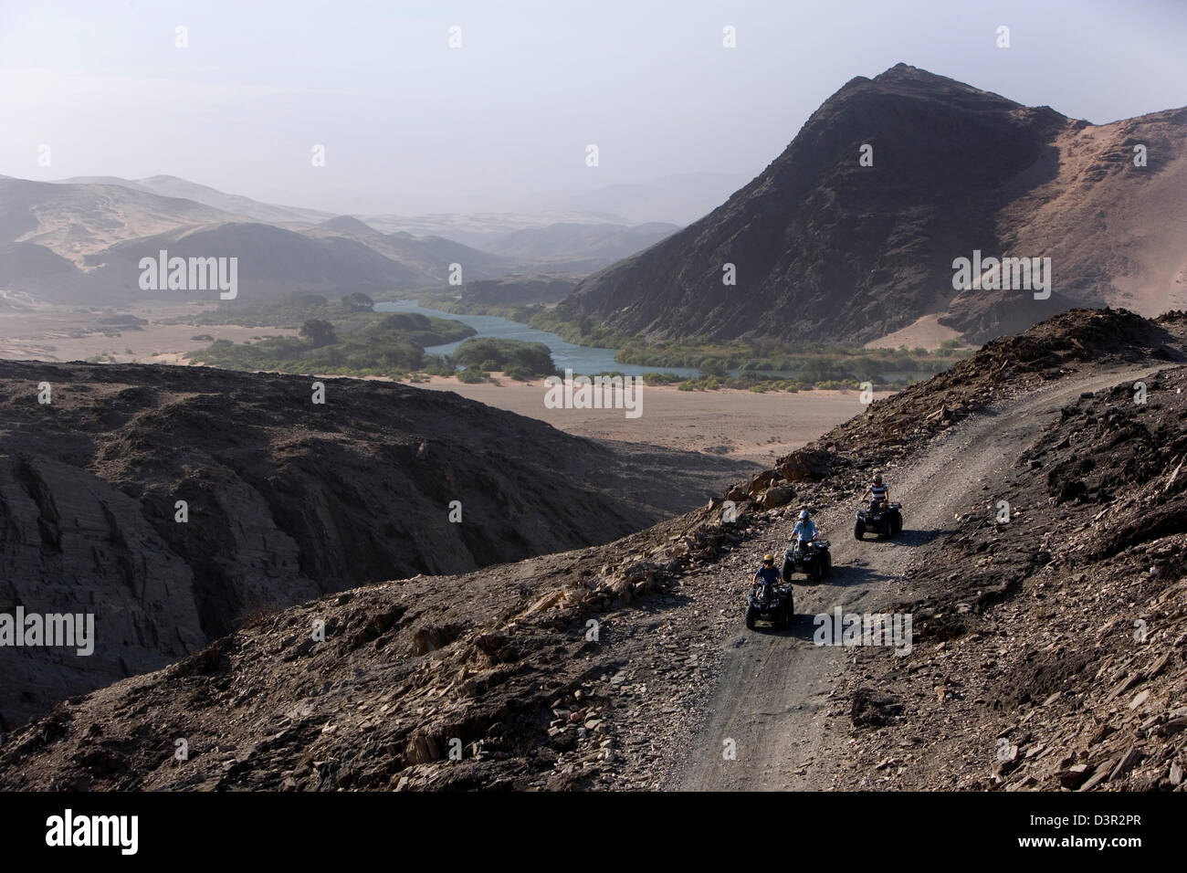 Quad biking in desert landscape of Serra Caferna, Kaokoland, Namibia Stock Photo