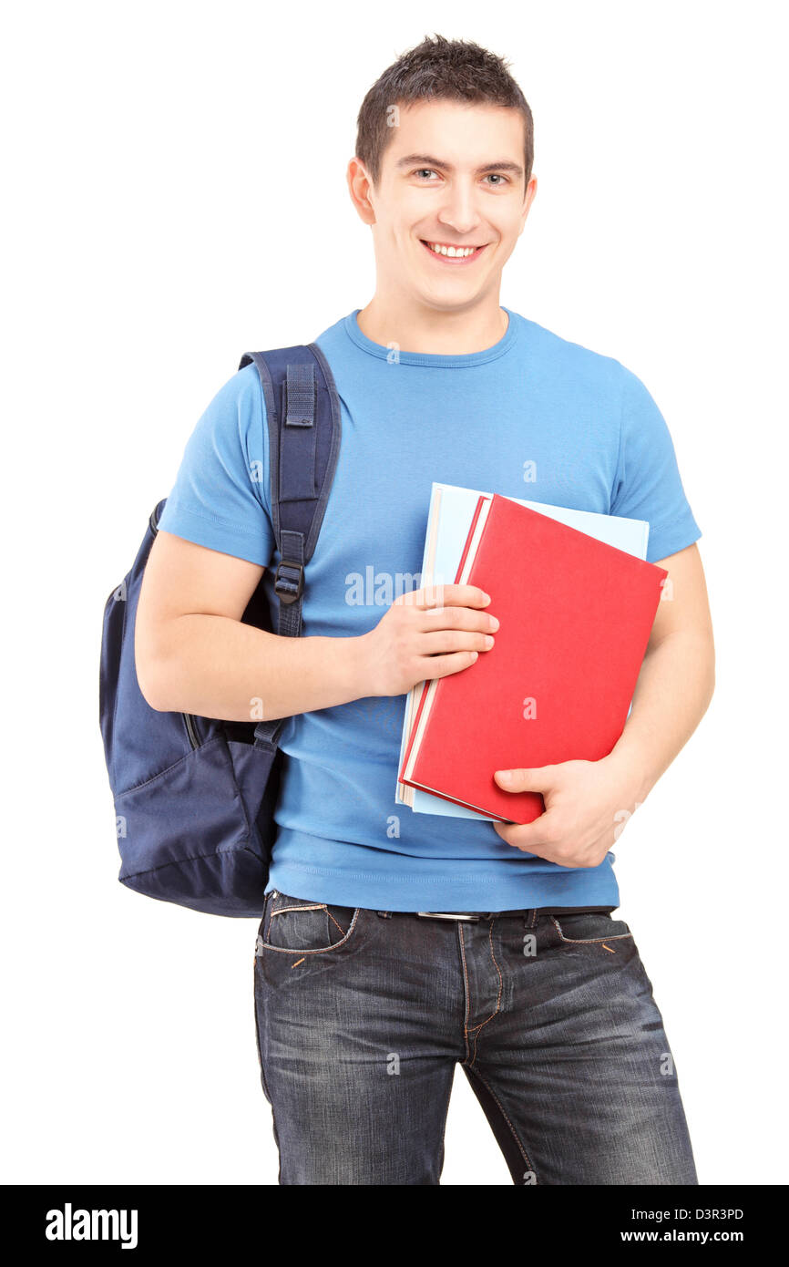 Smiling male student with backpack holding books isolated against white ...