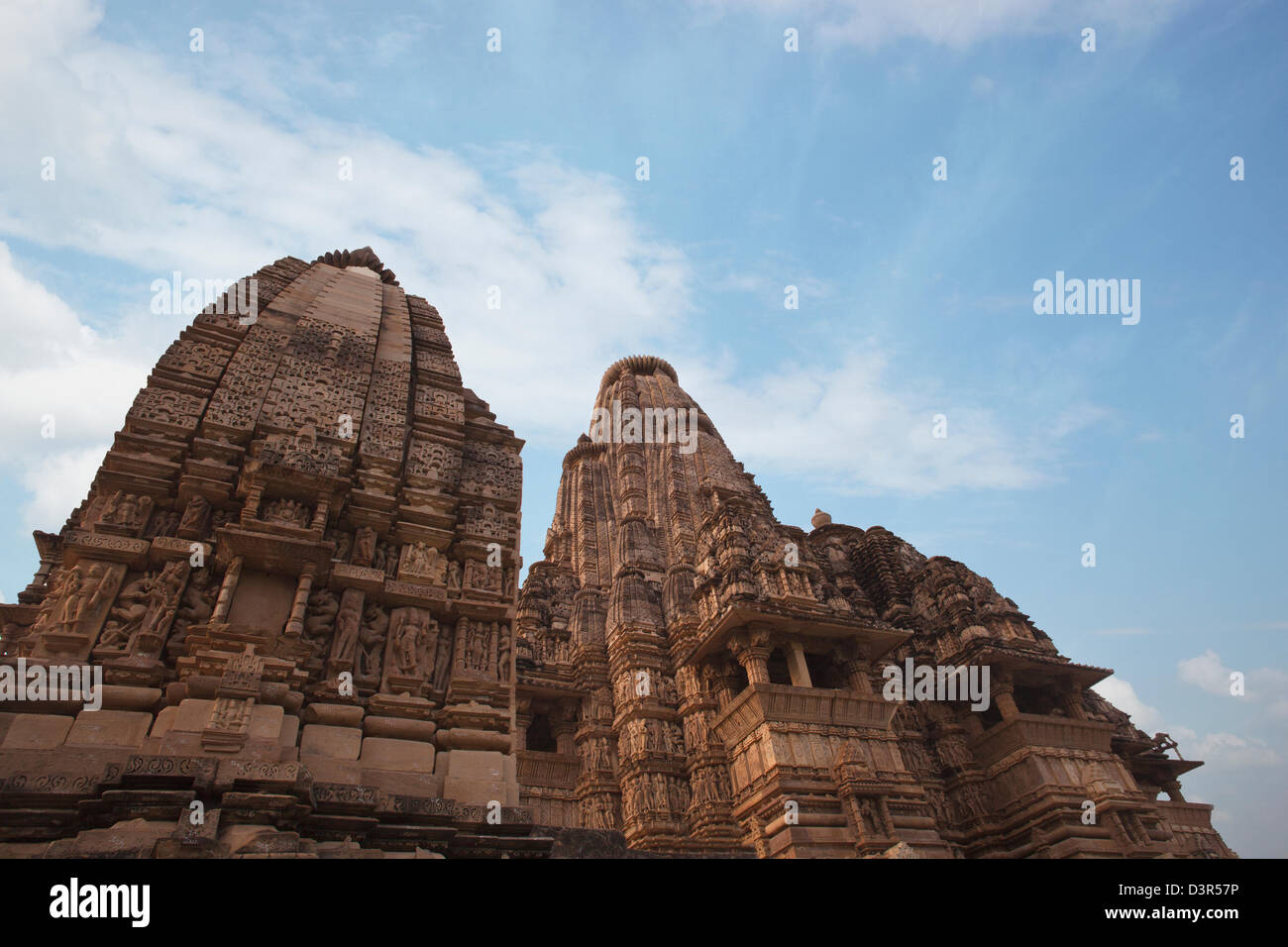 Low angle view of carvings at a temple, Khajuraho, Chhatarpur District, Madhya Pradesh, India Stock Photo