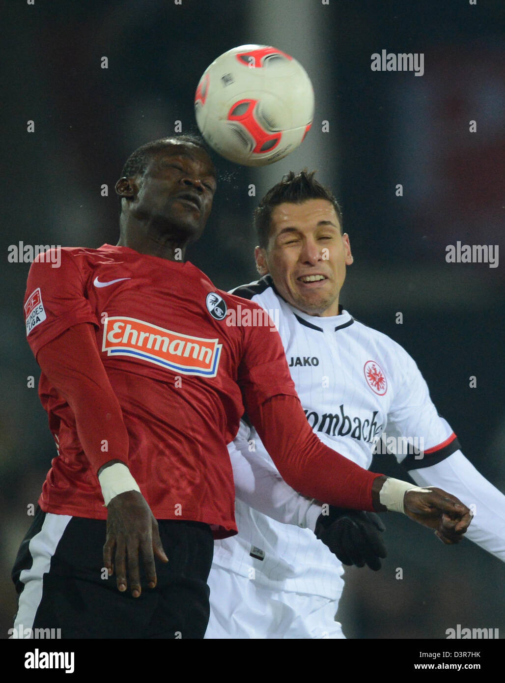 Freiburg, Germany. 22nd February 2013. Freiburg's Fallou Diagne (L) vies for the ball with Frankfurt's  Karim Matmour during the Bundesliga soccer match between SC Freiburg and Eintracht Frankfurt at Mage Solar Stadium in Freiburg, Germany, 22 February 2013. Photo: Patrick Seeger/dpa/Alamy Live News Stock Photo