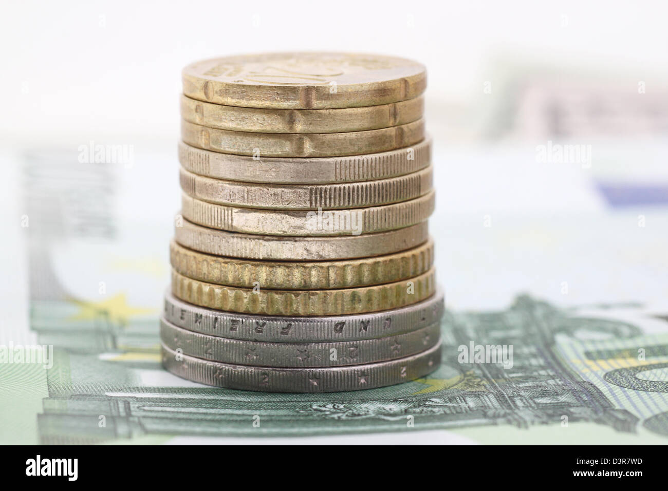 pile of euro coins on banknotes Stock Photo