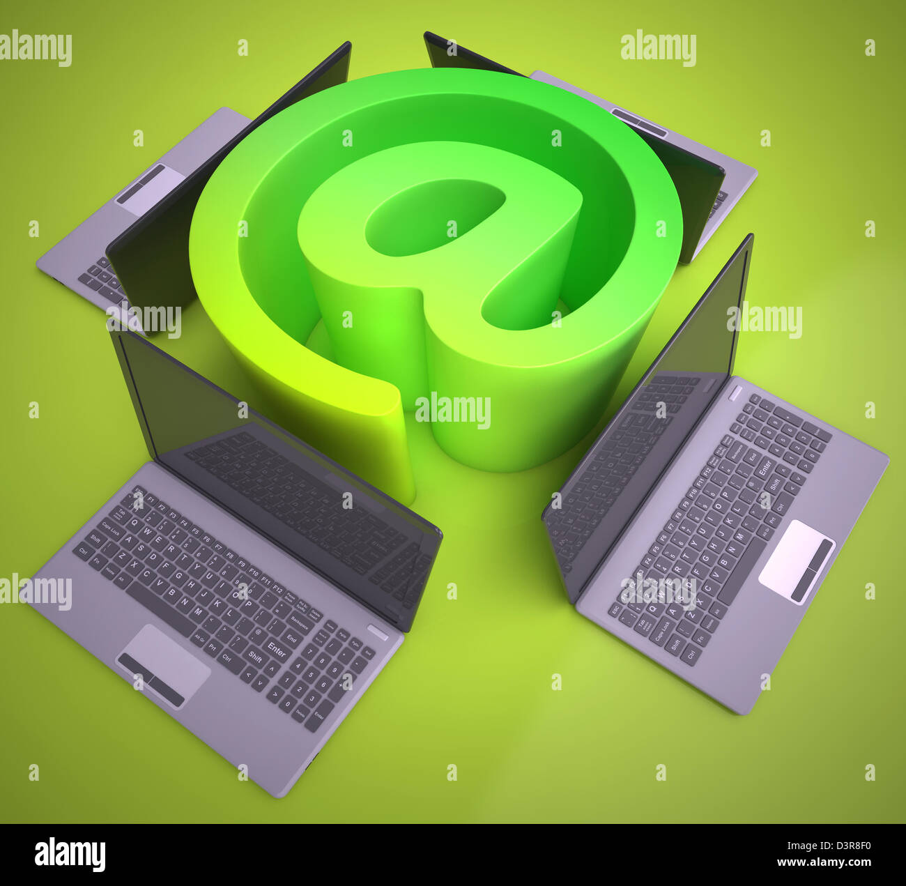 At Sign Laptops Showing Online Mailing Communication Stock Photo - Alamy