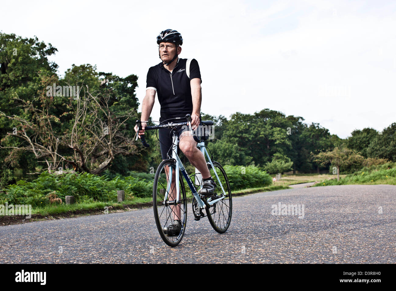 Cyclist on Olympic cycle route, Richmond Park, London, England, UK Stock Photo